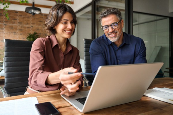 finance manager discussing plans and strategies with their middle aged client