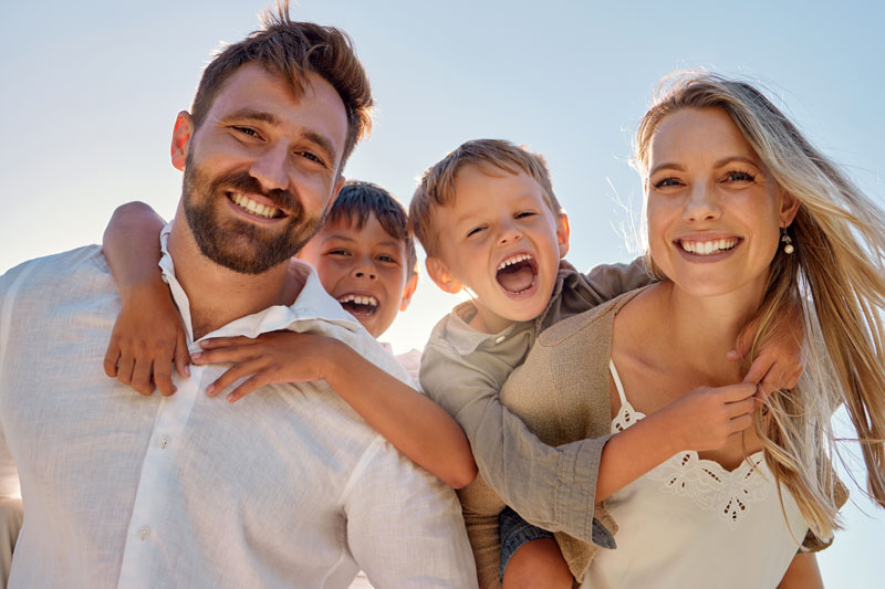 a happy family that is enjoying time after planning their finances