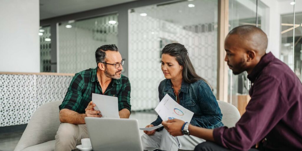 a married couple going over their retirement plan with an advisor