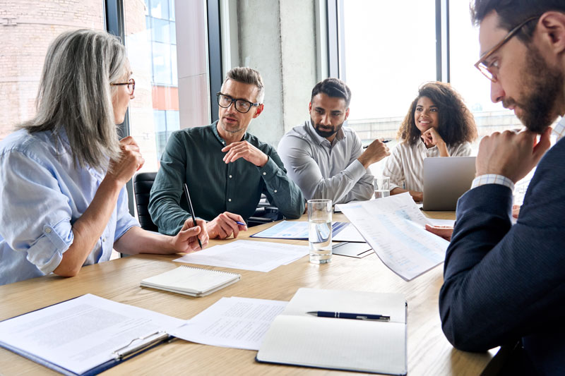 business executives receiving advice from professional wealth planners