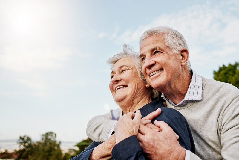 elderly couple enjoying life after planning their wealth