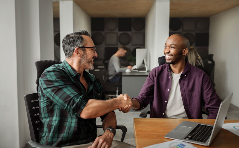generational wealth planner shaking hands with a client