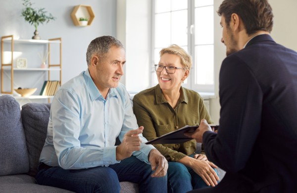 older couple discussing their executive advisory plans with their finance advisor at kirk capital