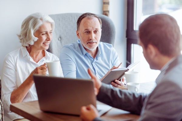 older couple discussing their tax planning needs with their financial advisor