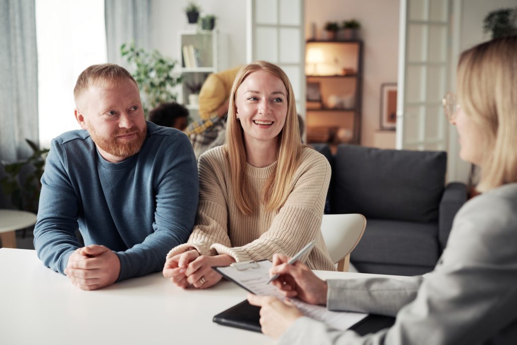 young couple meeting with a financial advisor