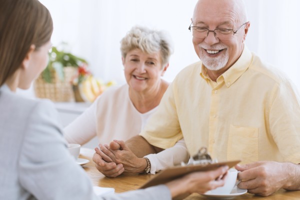 senior citizens discussing their social security plan with their finance officer at kirk capital