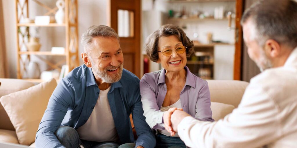 senior couple happy to speak with an investment advisor