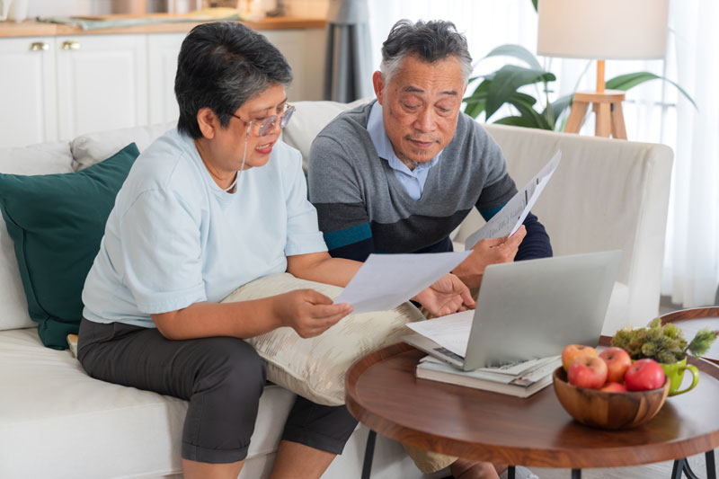 senior couple reviewing and planning their finances for their family