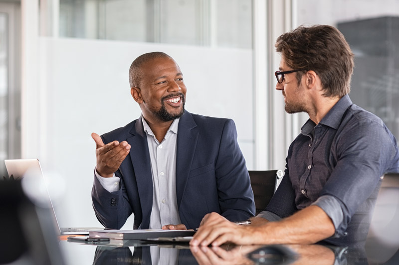 two business professionals discussing employee retirement plans