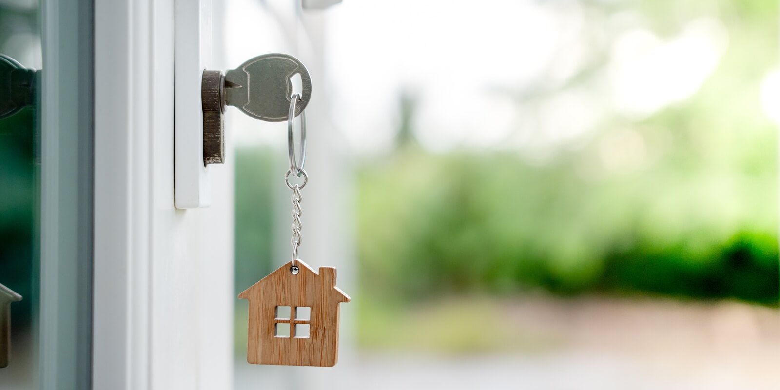 landlord key for unlocking house is plugged into the door