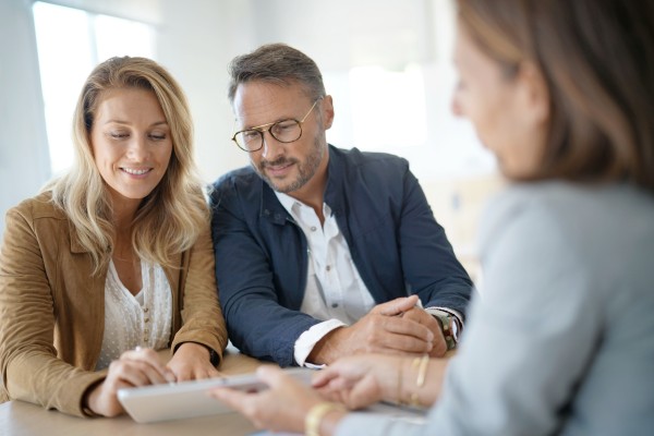 mature couple meeting with their financial advisor