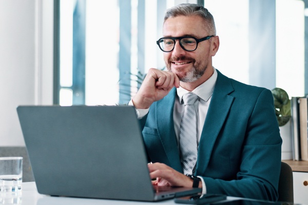 senior financial advisor reviewing their reports before a client consultation