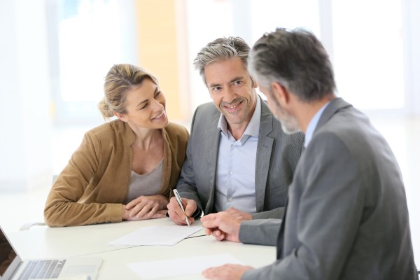 wealthy high net worth couple discussing their financial needs with kirk capital